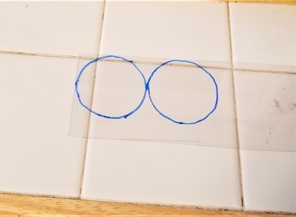 Two circles traced on a clear plastic.