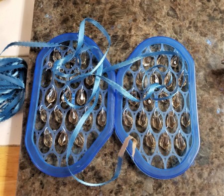 Butterfly Suncatcher Using Unique Lids - after glue has dried wrap ribbon around body