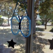 Butterfly Suncatcher Using Unique Lids - hanging in window