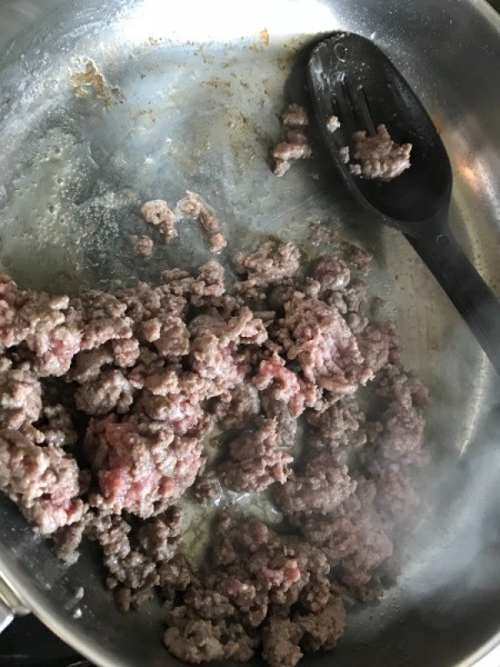 Browning ground beef in pan
