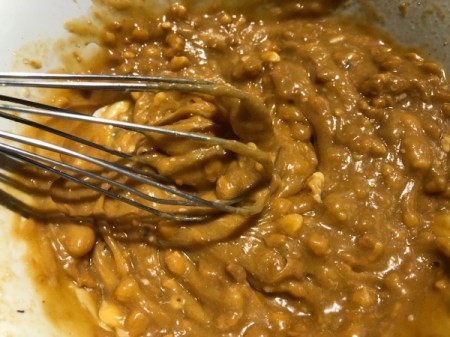 mixing peanut butter and butter in batter