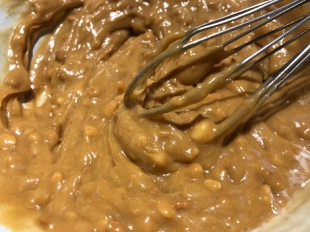 mixing milk into batter