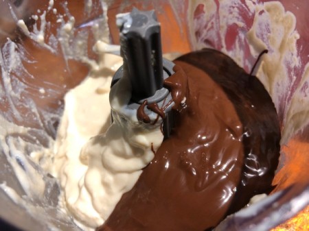 adding melted chocolate to blended tofu