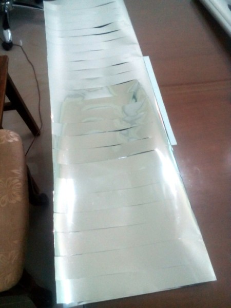 DIY Cheering Pom Poms - cut leaving one inch space at the top of the foil