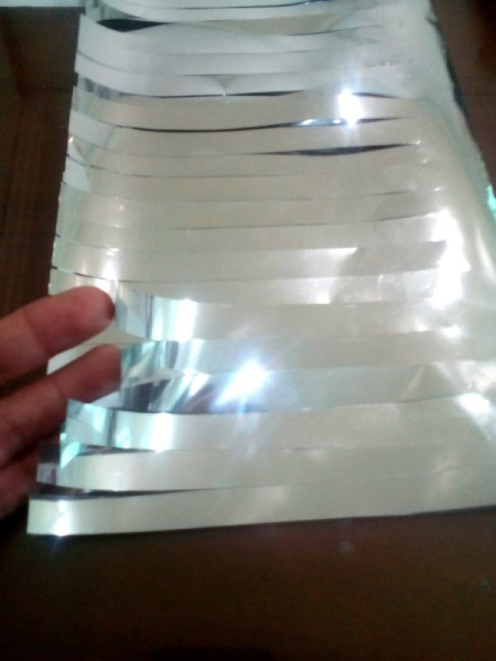 DIY Cheering Pom Poms - cut each one inch strip in half