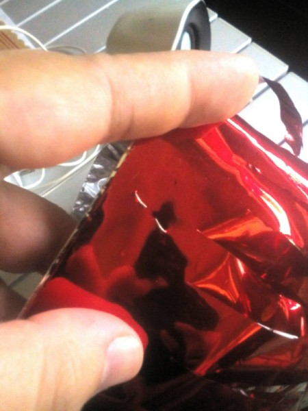 DIY Cheering Pom Poms - stack the two pieces of foil together and staple