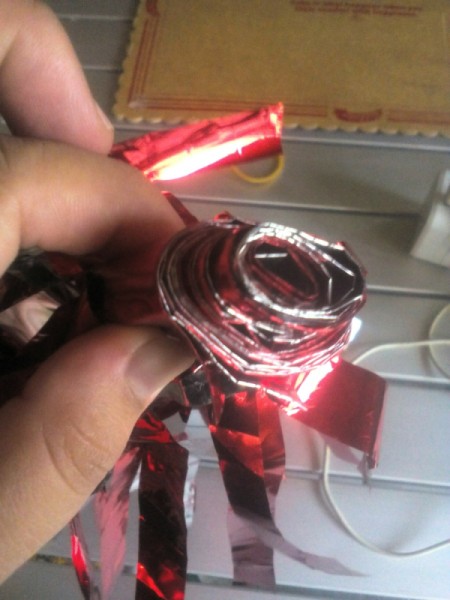 DIY Cheering Pom Poms - rolled foil layers