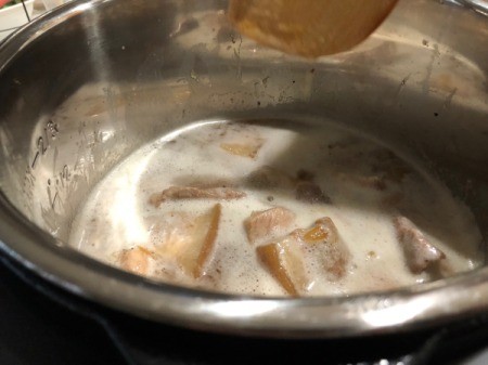 adding coconut water to pot