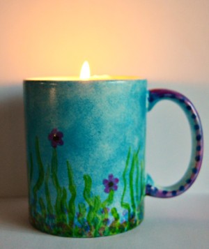 Mug Turned Colorful Candle Holder - candle burning inside the cup