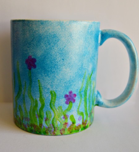 Mug Turned Colorful Candle Holder - paint magenta flowers and add some dots in the same color around the bottom in the grass
