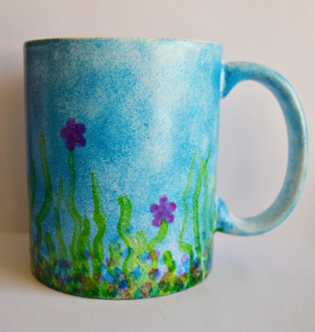 Mug Turned Colorful Candle Holder - add blue dots to create shadows in the grass