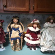 Identifying Porcelain Dolls - 4 dolls on stands