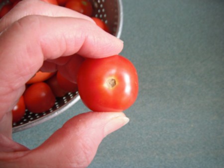 A ripe cherry tomato.