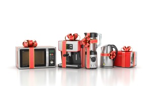 Small kitchen appliances with red ribbon bows.