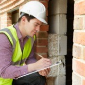 Home inspector with a clipboard.