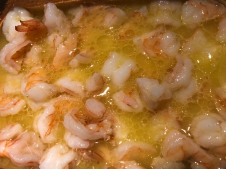 Shrimp pieces added to bowl