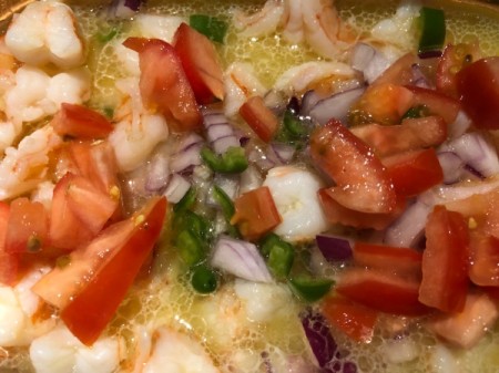 Tomatoes, jalepenos and onions added to pan