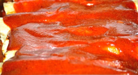 Enchiladas covered with sauce