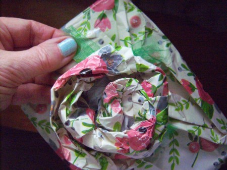 Flower Gift Wrapping - spreading the tulle out over the top of the gift