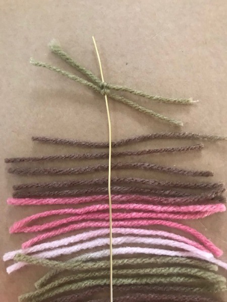 Recycled Cardboard Ring and Yarn Dreamcatcher - yarn knotted to wire