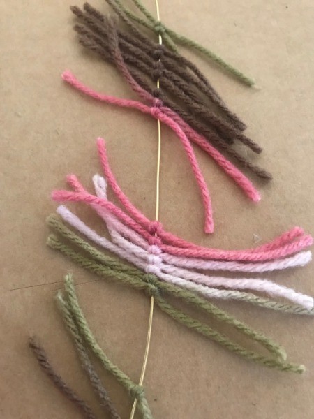 Recycled Cardboard Ring and Yarn Dreamcatcher - slide the knotted yarn together
