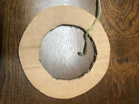 Recycled Cardboard Ring and Yarn Dreamcatcher - knot the end of your yarn around the cardboard