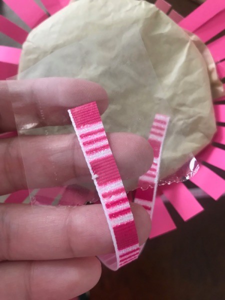 Jellyfish Piñata for Kids - use lightweight tape for the ribbons that won't rip the tissue and packing tape for the one that will release the goodies