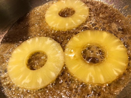Pineapple added to brown sugar and butter in pan