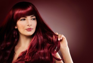Woman with dark red hair.