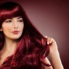 Woman with dark red hair.
