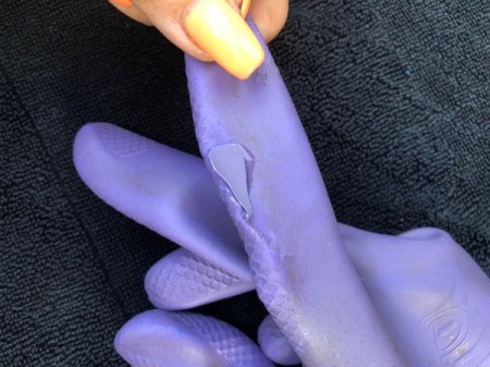 How to Patch Tears in Rubber Gloves - have glove flat and dab on a bit of glue and place the patch on top