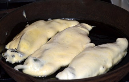 battered chilis in pan