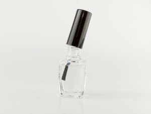 Clear nail polish on white background.