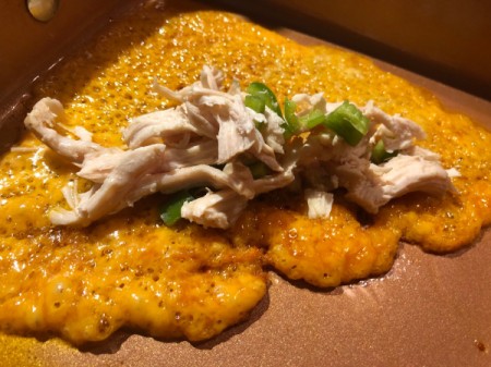 Chicken and chilis on melted cheese