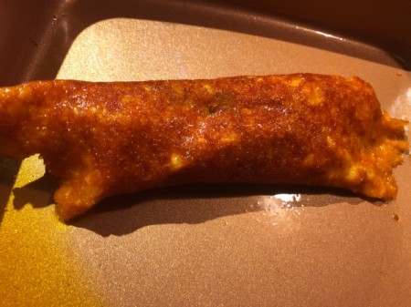 Cheese-Wrapped Chicken Enchilada on pan