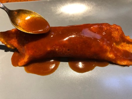 spooning sauce on Cheese-Wrapped Chicken