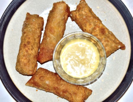 Chicken Egg Rolls on plate with dipping sauce