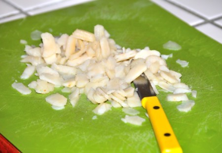 chopping water chestnuts and garlic