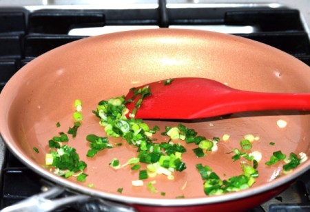 cooking green onions in pan
