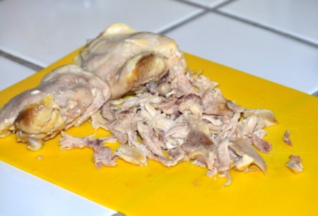 cutting chicken on board