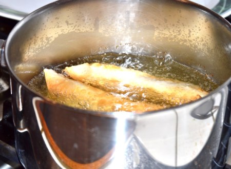 cooking Chicken Egg Rolls in hot oil