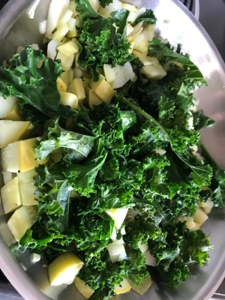 adding kale to pan