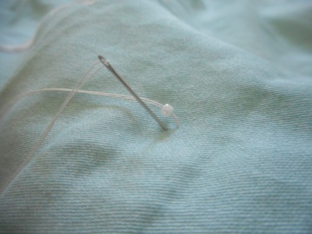 Tufting a Comforter - begin sewing on beads as you did with buttons