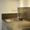 Grey laminate countertop with a sink.