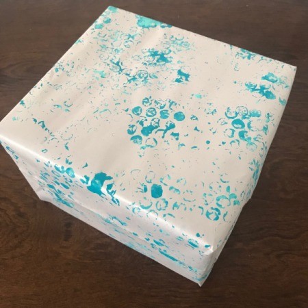 Wrapping Paper and Bow Made from Packaging Items - wrapped gift