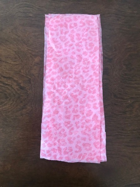 Wrapping Paper and Bow Made from Packaging Items - cut and stacked pieces of tissue paper