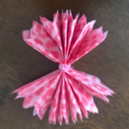 Wrapping Paper and Bow Made from Packaging Items - expand the layers of the bow