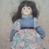 Information on a Porcelain Doll - doll wearing a blue and pink floral dress