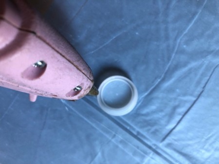 Upcycled Plastic Bottle Cap Light - add dabs of glue to edges of the daps