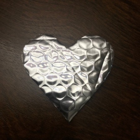 Upcycled Water Jug Gift Basket - cut a heart shape from bubble wrap